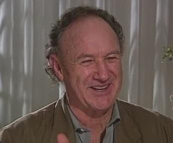 Gene Hackman w charakterystycznej roli filmowej, ukazujący intensywność jego aktorstwa.
