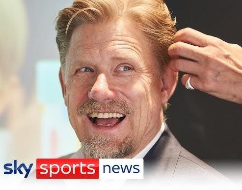 Peter Schmeichel w akcji, wykonujący paradę w stroju Manchesteru United.